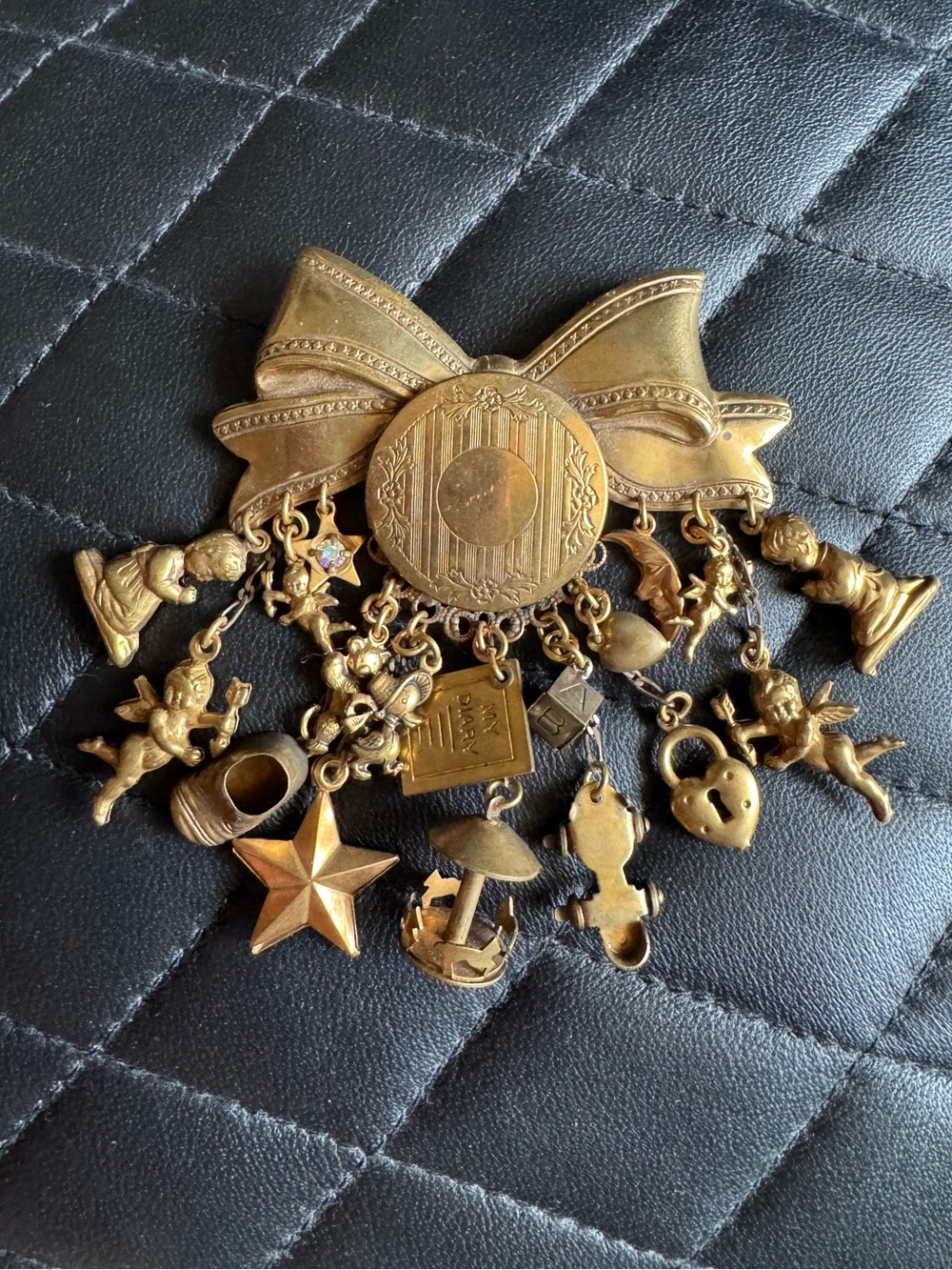 Vintage Brassy Gold Tone Metal Locket Brooch with Large Bow & Different Charms